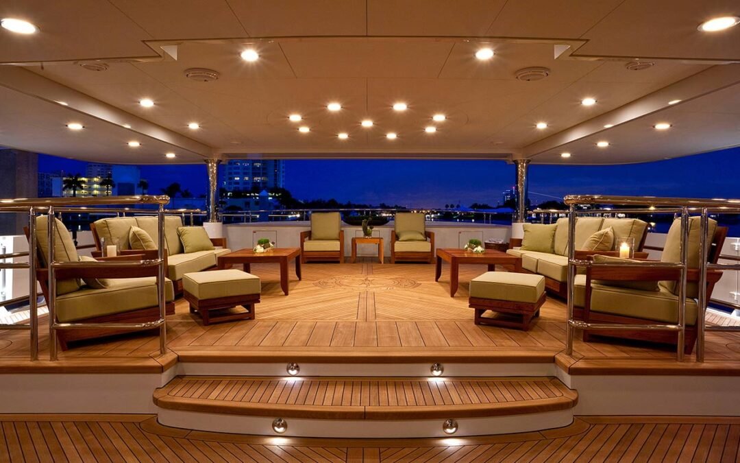 Evening setting on well lit deck with plenty of seating designed by Superyacht designer Patrick Knowles